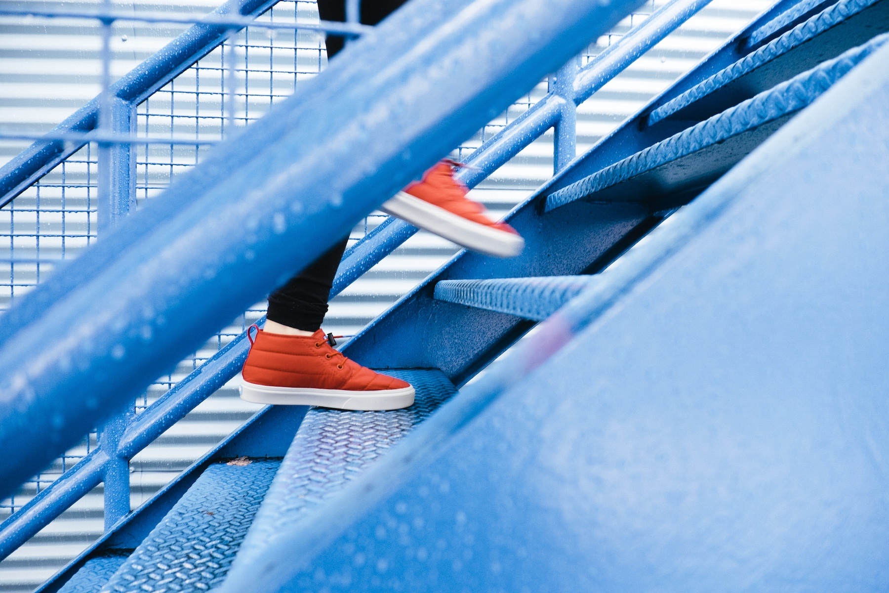 Red Sneakers on stairs_Lindsay Henwood_Stocksnap