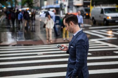 Guy in street on phone_ISO Republic