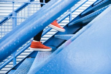 Red Sneakers on stairs_Lindsay Henwood_Stocksnap