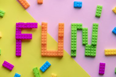 Fun spelled word with plastic blocks background